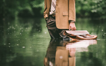 man in suit standing in flood