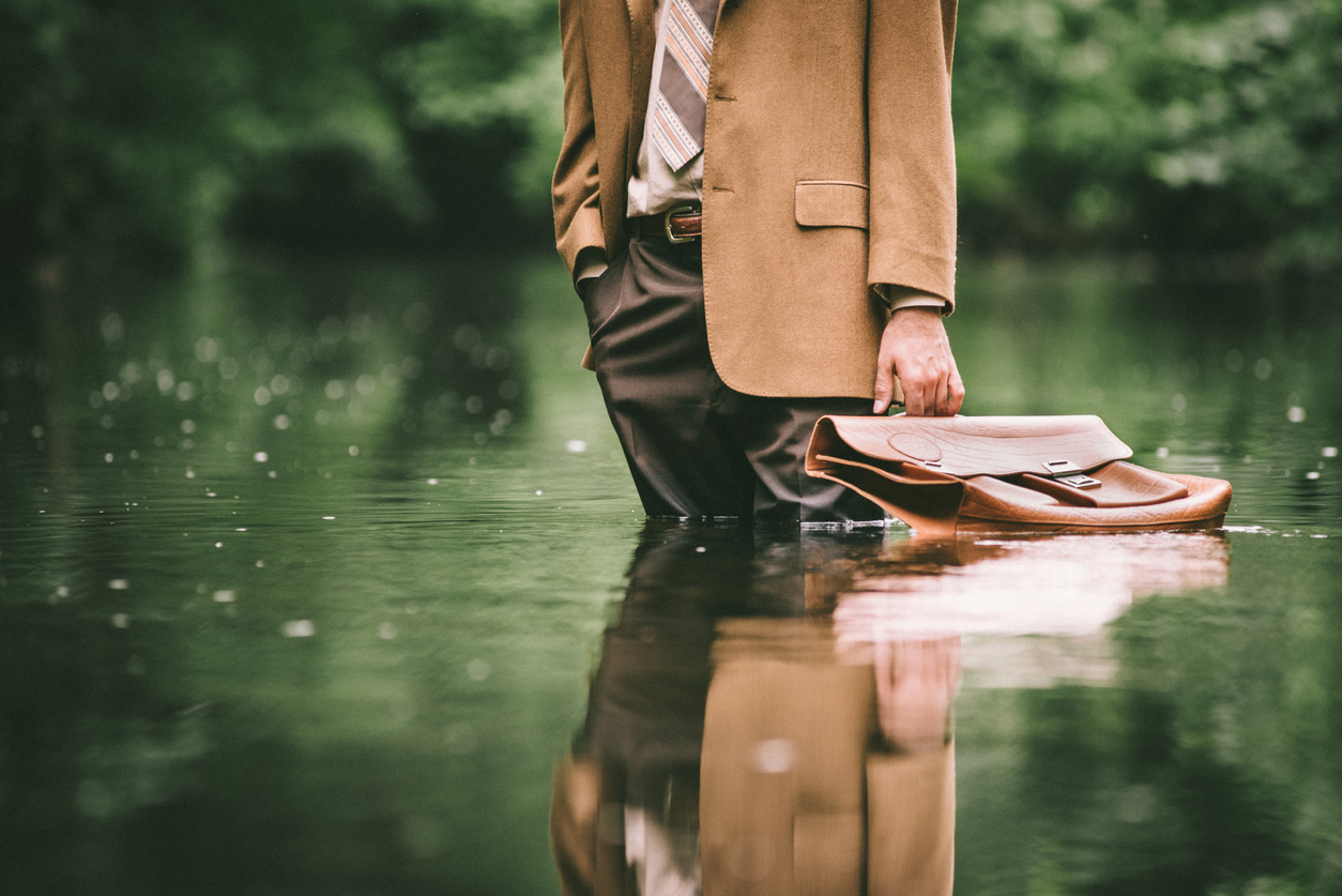 man in suit standing in flood